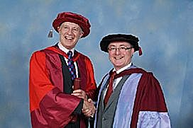 Owen Spencer-Thomas receives his doctorate from Professor Geoff Petts, Vice-Chancellor of the University of Westminster